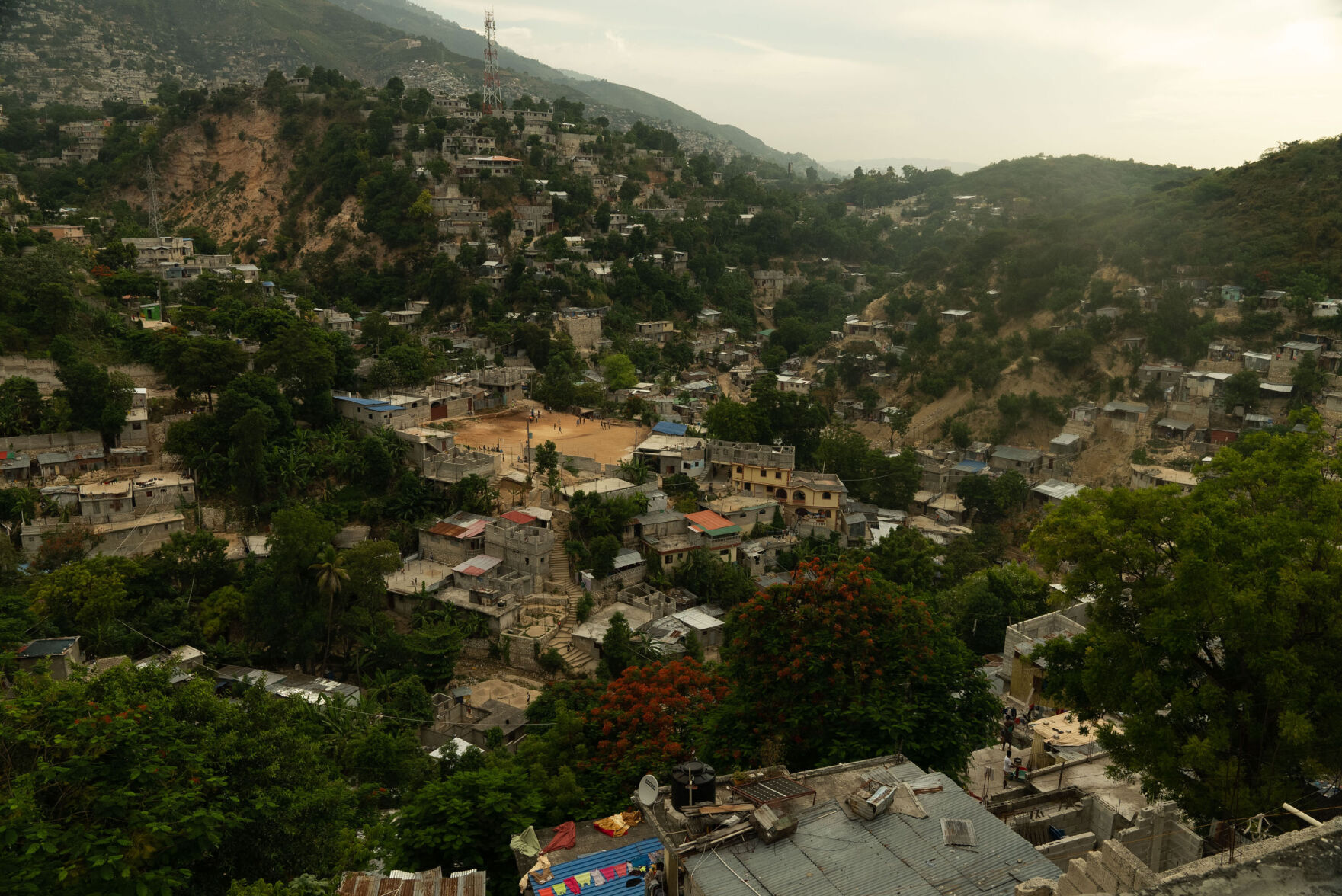 Fear stalks Haitians as their murdered president is buried and gangs terrorize the capital